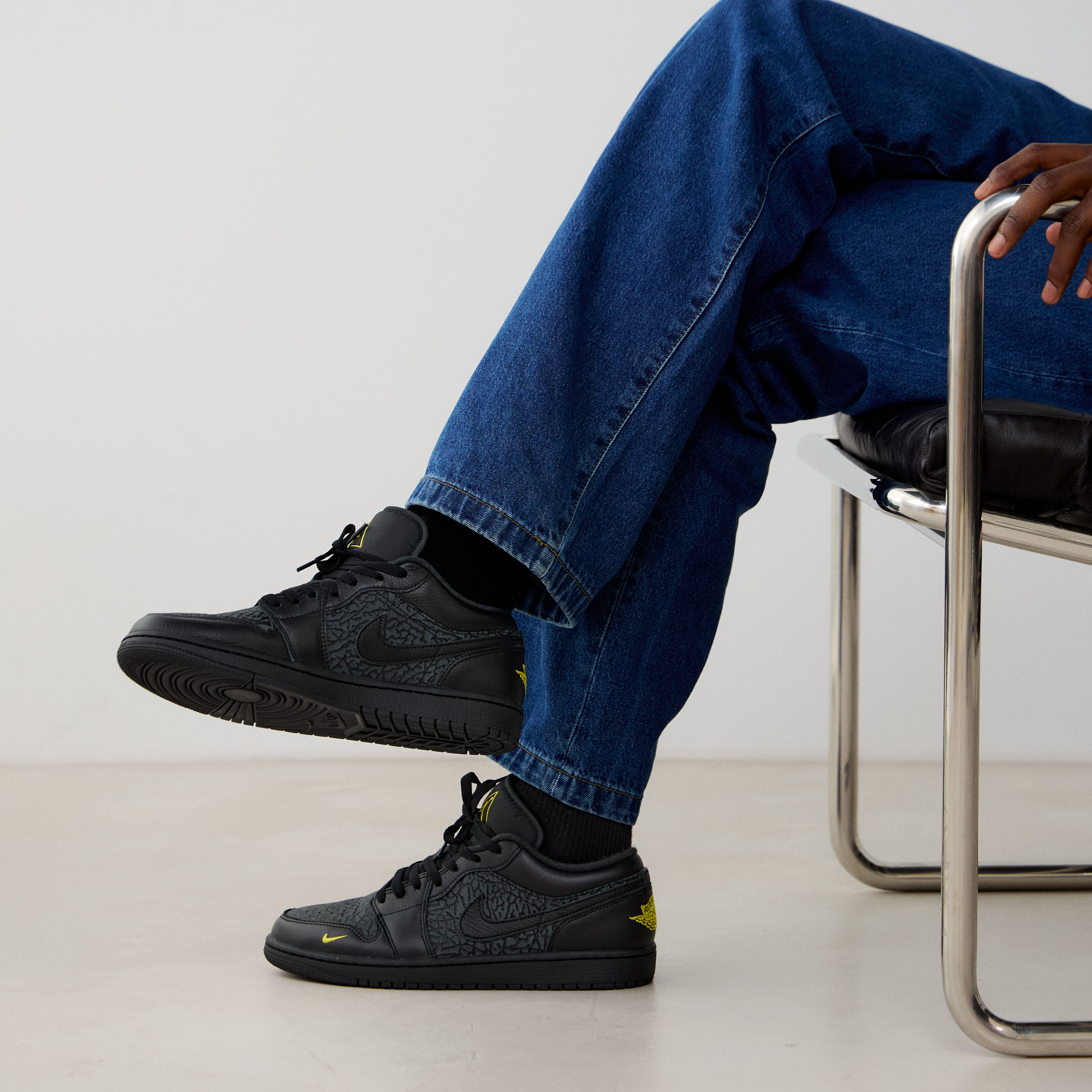 jordan 1 low triple black on feet