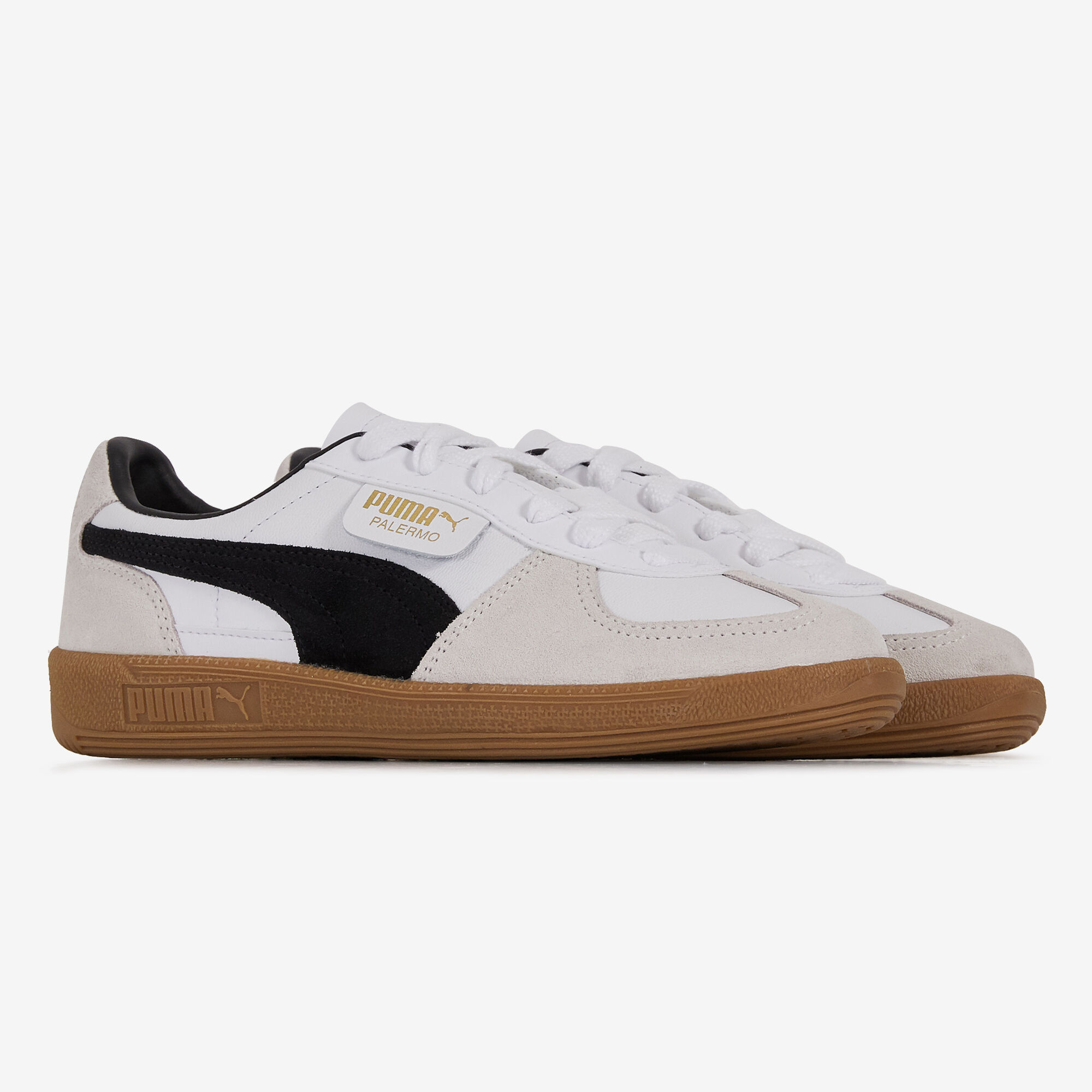 Black and sales white leather pumas