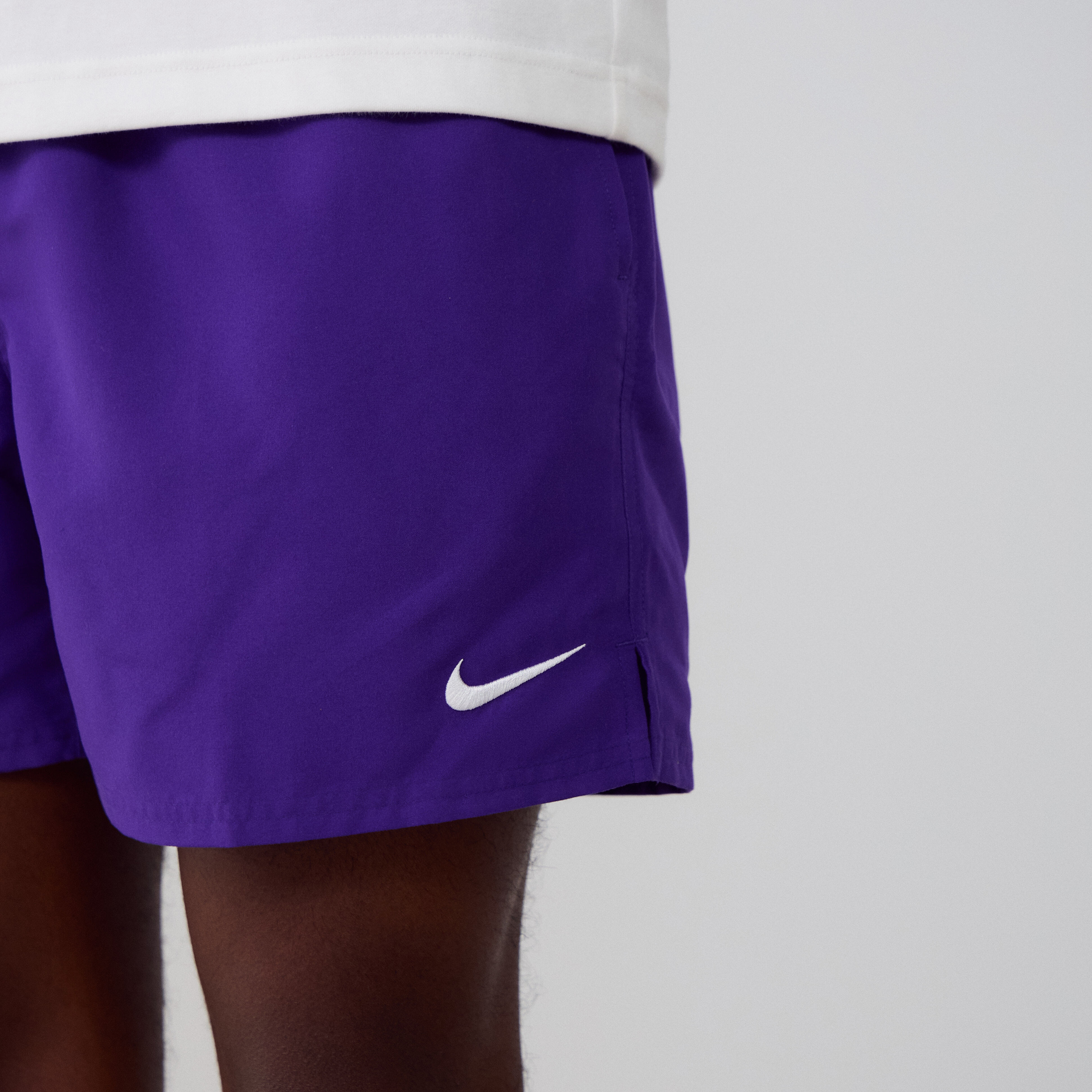 purple nike swim trunks