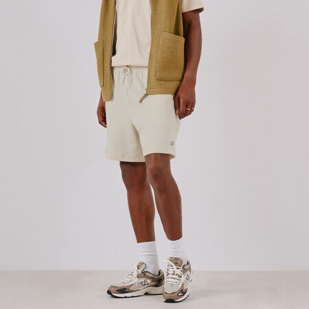 NEW BALANCE SHORT ESSENTIALS SMALL LOGO BEIGE MEN