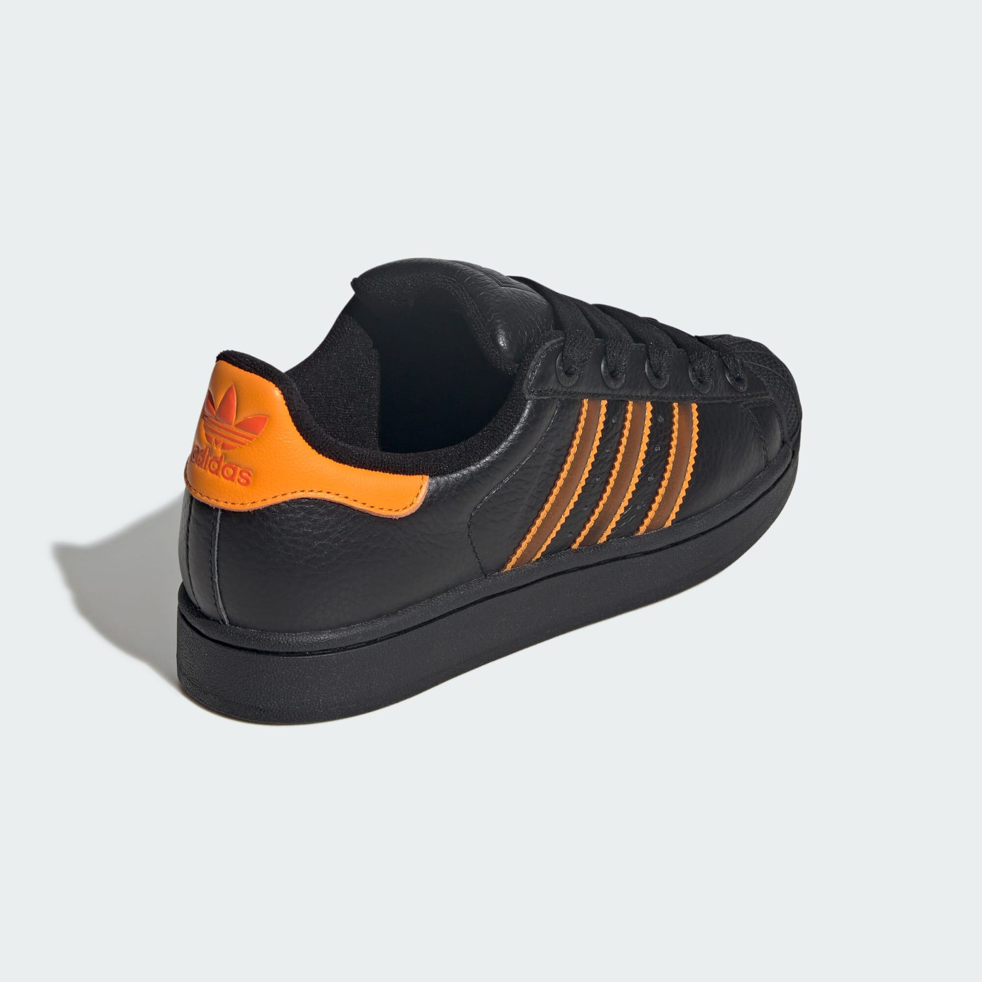 adidas shoes with orange stripes