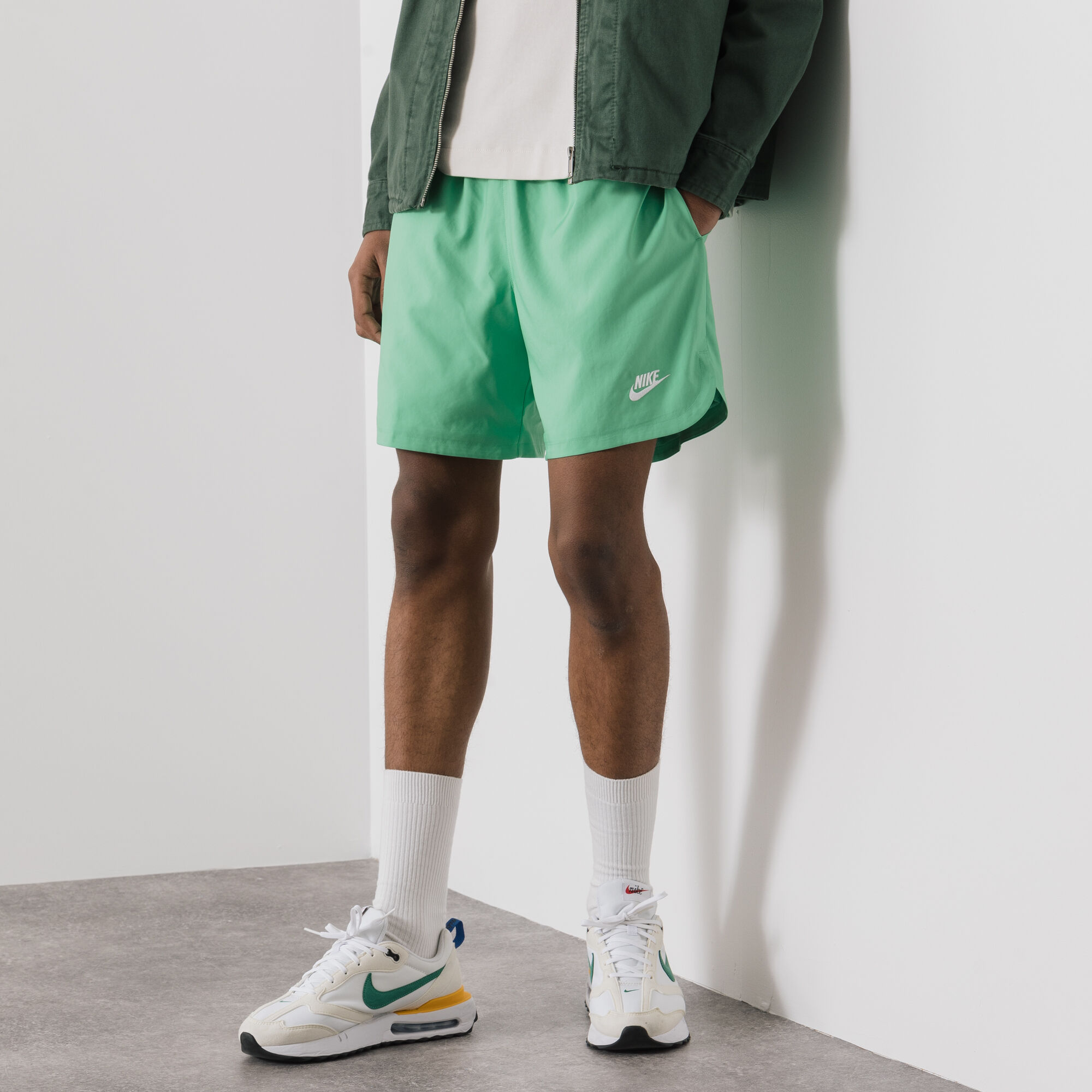 Nike flow shorts green online