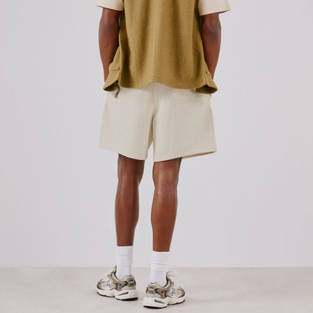 NEW BALANCE SHORT ESSENTIALS SMALL LOGO BEIGE MEN