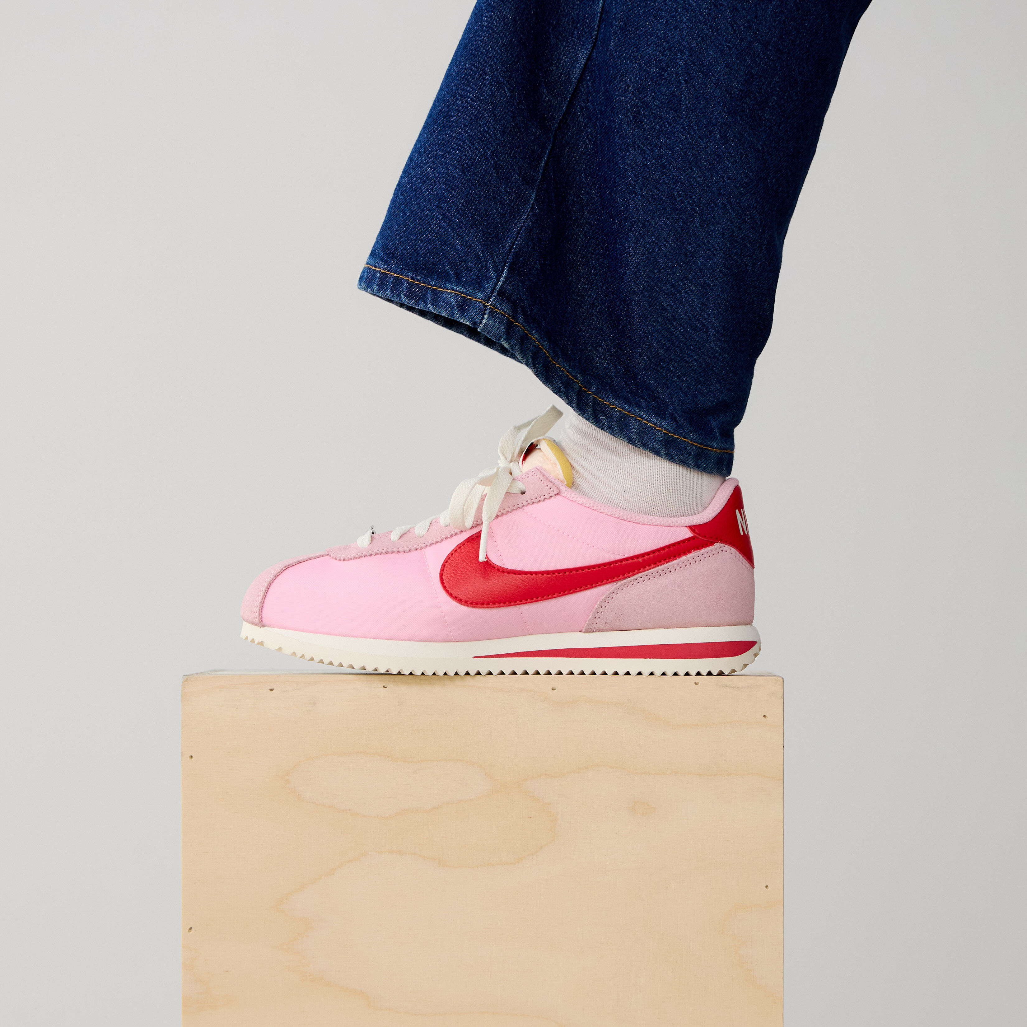 pink and red nike cortez