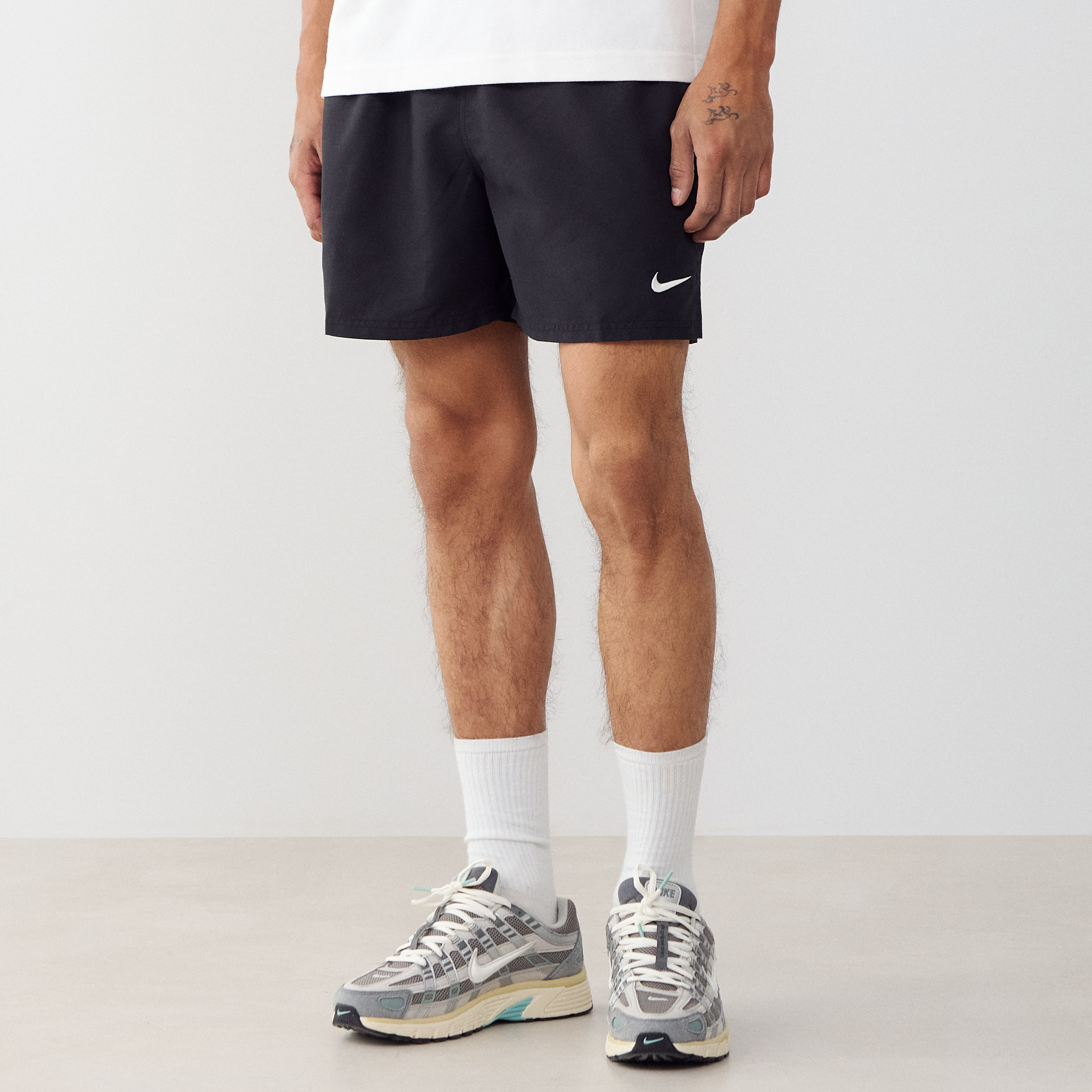 white swim trunks nike